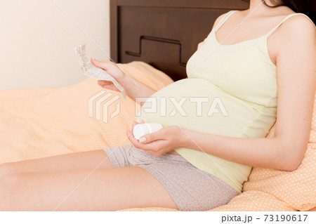 Pregnant Lady Reading Instruction For Prescribed Pills , healthcare concept, medicine during pregnancy Pregnant Lady Reading Instruction For Prescribed Pills , healthcare concept, medicine during pregnancy 73190617