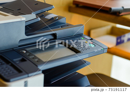 button on panel of copy machine or photocopier in office 73191117