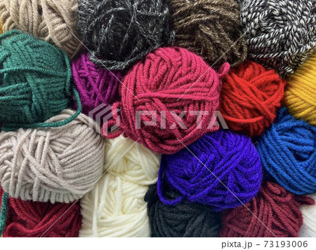 A motley background, colored and different textured yarn for knitting. 73193006