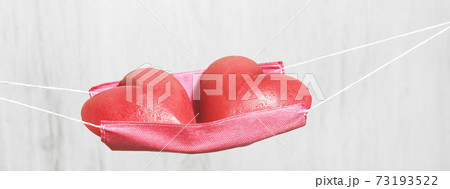Two red hearts in a face mask hammock 73193522