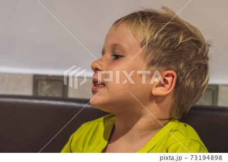 Close up portrait cute boy change his mood from smiling till serious, surprised, intriguing, cunning, funny, mischievous, sad, daydreaming. Happy childhood,home education, family relationship concept 73194898