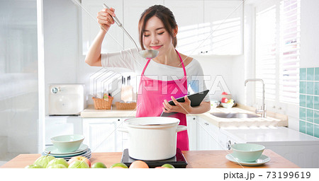 Asian housewife use tablet Asian housewife use tablet 73199619