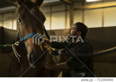 競走馬と飼育員の写真素材