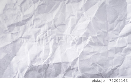 Close-up white crumpled paper texture background. Close-up white crumpled paper texture background. 73202148