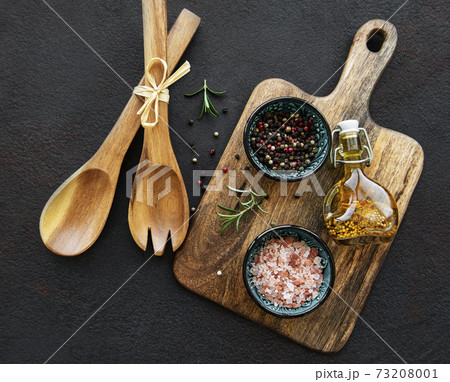 Old wooden kitchen utensils and spices 73208001