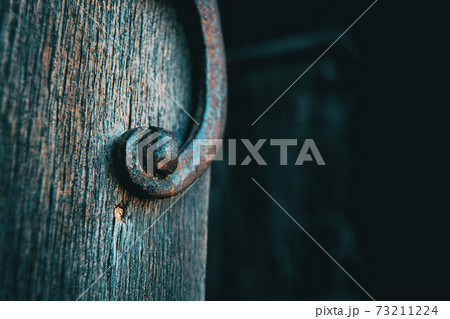 detail of an old wrought iron doorknob detail of an old wrought iron doorknob 73211224