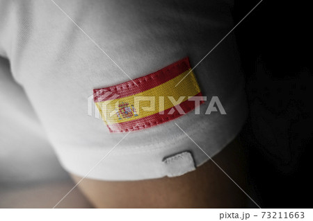 Patch of the national flag of the Spain on a white t-shirt Patch of the national flag of the Spain on a white t-shirt 73211663
