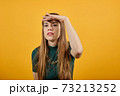Portrait holding hand over eyes, looking at long distance confident determined 73213252