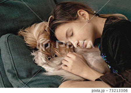 Beautiful girl sleeping with her dog. Best friends. Lifestyle Beautiful girl sleeping with her dog. Best friends. Lifestyle 73213306