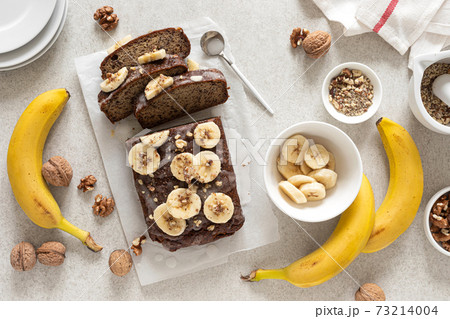 Banana bread cooking on kitchen table, top view Banana bread cooking on kitchen table, top view 73214004