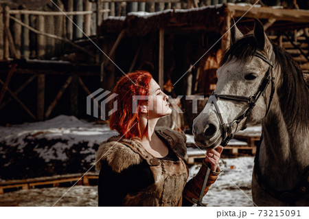 Viking girl. Reconstruction of a medieval scene 73215091
