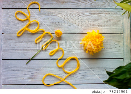 letters spring made of knitting yarn, crochet and yellow ball of yarn. spring colors for knitting. letters spring made of knitting yarn, crochet and yellow ball of yarn. spring colors for knitting. 73215961