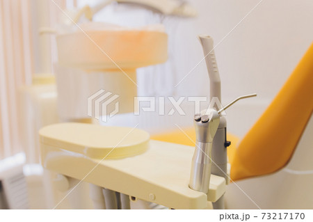 View of modern empty dental surgery yellow chair. View of modern empty dental surgery yellow chair. 73217170