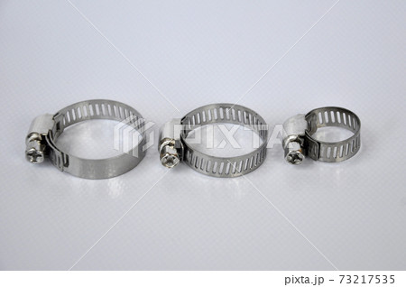 Metal hose clamps isolated on white background.  73217535