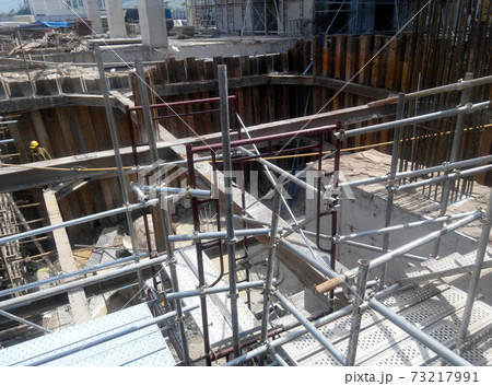 MALACCA, MALAYSIA -DECEMBER 07, 2016: Construction activity by construction workers for foundation work inside the sheet pile cofferdam retaining wall area.  73217991