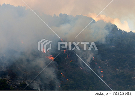 a United Nations helicopter extinguishes a fire on the Israel-Lebanon border	 73218982