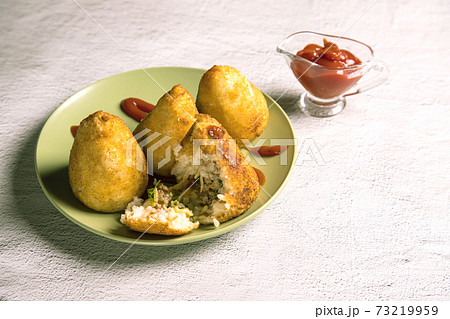 Sicilian dish arancini-fried rice balls. Italian cuisine. Copy space. Horizontal orientation 73219959