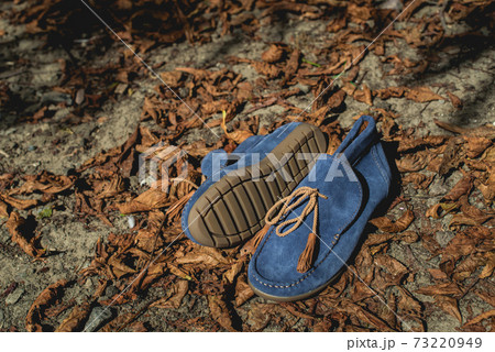 men's shoes moccasins blue color on a orange autumn fallen leaves men's shoes moccasins blue color on a orange autumn fallen leaves 73220949