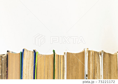 many books standing in a row isolated 73221172