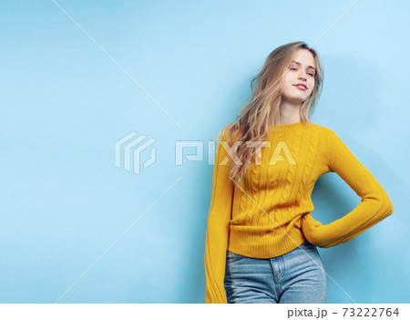 young pretty teenage modern hipster girl posing emotional happy on blue background, lifestyle people concept young pretty teenage modern hipster girl posing emotional happy on blue background, lifestyle people concept 73222764