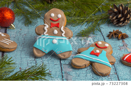 pair of gingerbread cookies. gingerbread in the shape of a man and a woman. Homemade ginger cookies or Christmas. sweet treats for new year holidays 73227308