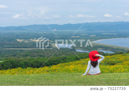 Beautiful woman in nature flower. 73227720