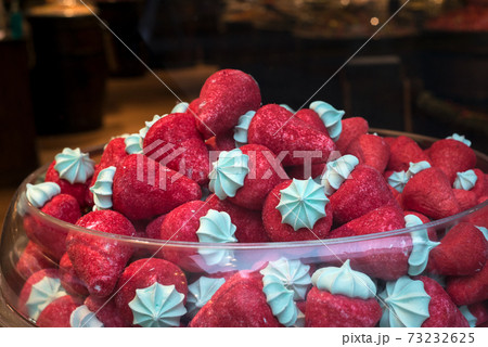 Closeup of candies pile in shaped strawberries in a candy shop showroom Closeup of candies pile in shaped strawberries in a candy shop showroom 73232625