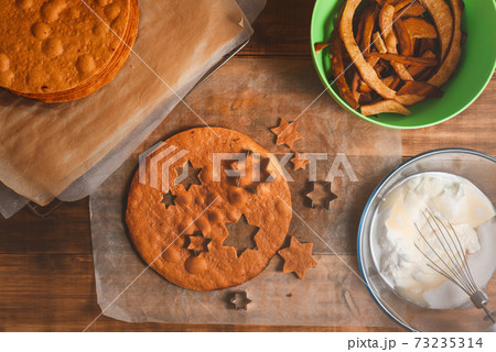 Bakery ingredients and kitchen utensils on wooden rural kitchen table for baking thematic background. Bakery ingredients and kitchen utensils on wooden rural kitchen table for baking thematic background. 73235314