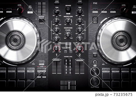 DJ controller close up view in live performance night club dance music. Dj. DJ controller close up view in live performance night club dance music. Dj. 73235675