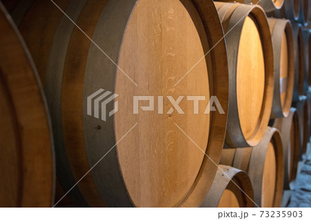 Barrels of wine in the cellar 73235903