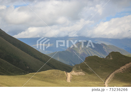 Panorama of road in mountains of national park Dombay, Caucasus 73236266