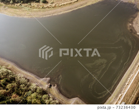 Aerial view with the drone of a large pond 73236430