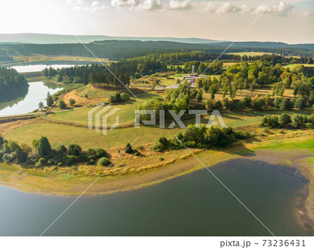 Aerial view with the drone of a large pond  73236431