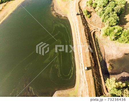 Aerial view of the dam between two artificial ponds 73236436