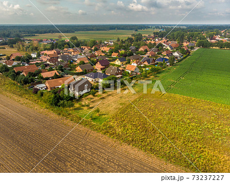 Aerial view of a small village in northern Germany  73237227