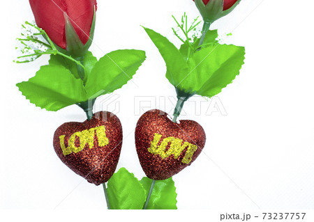 Valentine's Day background. Two red rose on white background. Can be used for weddings, Mother's Day, Women's Day, Friendship Day, and all holidays 73237757