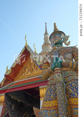 Patterned sculpture of a demonic warrior near a Buddhist temple. Patterned sculpture of a demonic warrior near a Buddhist temple. 73239654