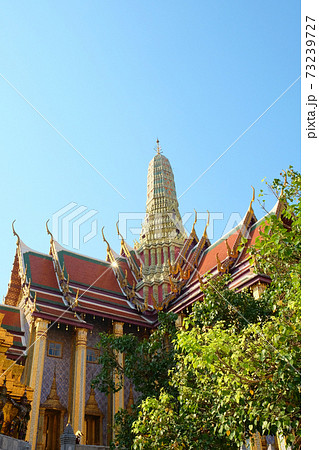 Temple of the Emerald Buddha on a sunny day. Sample of religious architectural art of Southeast Asia. 73239727