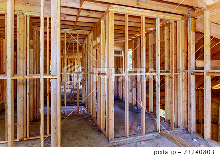 Wooden house roof frame structure on a new development 73240803