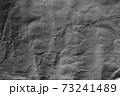 Dark grey crumpled background paper texture 73241489