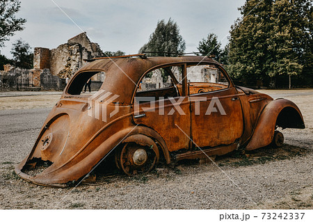 Destroyed cars during World War 2 in the city Oradour sur Glane France Destroyed cars during World War 2 in the city Oradour sur Glane France 73242337
