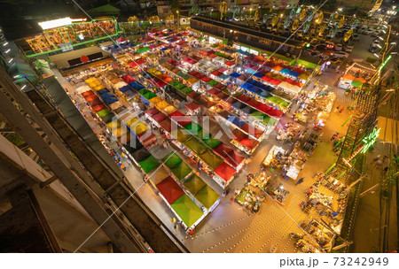 Aerial top view of Night Market people walking street, Colorful tents in the train of Ratchada at Bangkok city, Thailand. Rerail shops Aerial top view of Night Market people walking street, Colorful tents in the train of Ratchada at Bangkok city, Thailand. Rerail shops 73242949