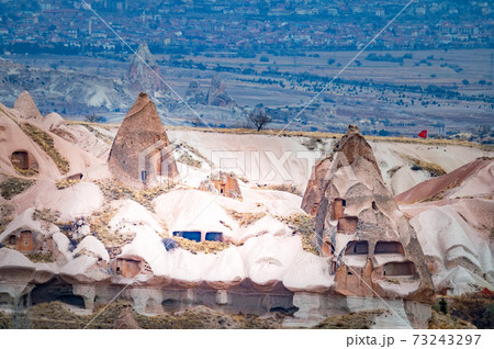 Old buildings of Unesco World Heritage, Cappadocia, Turkey under cloudy sky 73243297