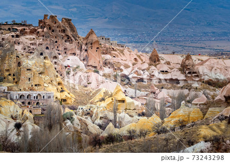 Landscape view of Uchisar, Cappadocia, Turkey under cloudy sky 73243298