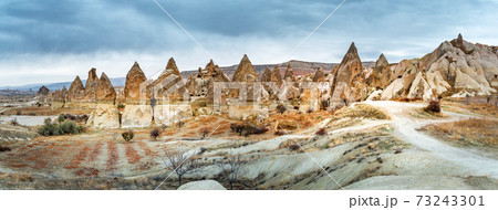 Landscape view of Unesco World Heritage, Cappadocia, Turkey under cloudy sky Landscape view of Unesco World Heritage, Cappadocia, Turkey under cloudy sky 73243301