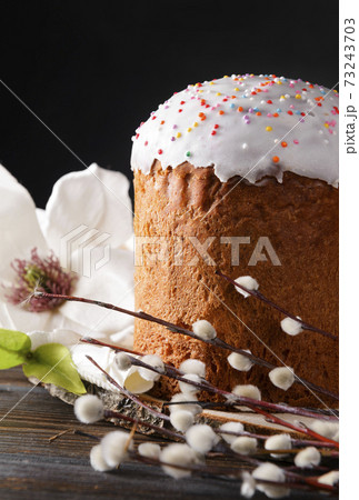 easter cake with willow twigs and a white magnolia flower on a dark 73243703