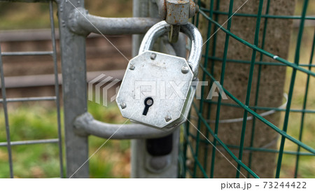 Rural security padlocks, barbed wire fencing 73244422