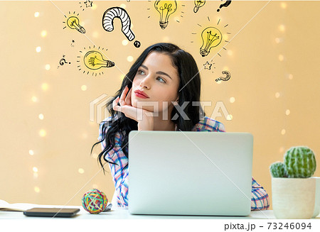 Question with light bulbs with young woman Question with light bulbs with young woman 73246094