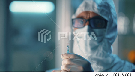 Doctor with syringe working in hospital Doctor with syringe working in hospital 73246833