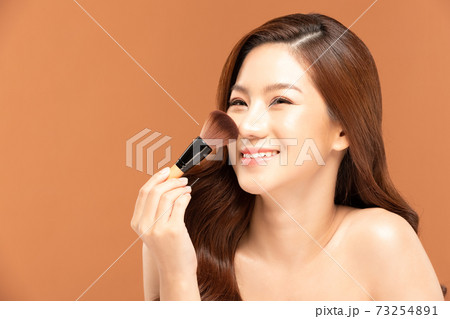 Beauty asian woman hold make up brush and cheerful with make up brush Beauty asian woman hold make up brush and cheerful with make up brush 73254891